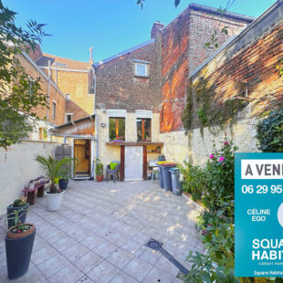 Immeuble avec commerce, habitation et jardin en coeur de ville.